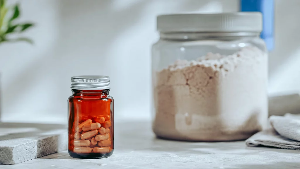 Concentrated Tribulus terrestris extract in a small jar against a cheap loose powder